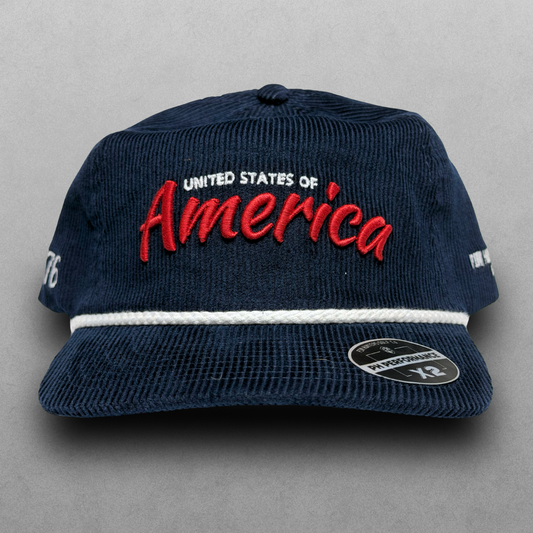 Navy corduroy America hat with red script embroidery, white United States of America text, white rope detail, and PH Performance X2 sticker.