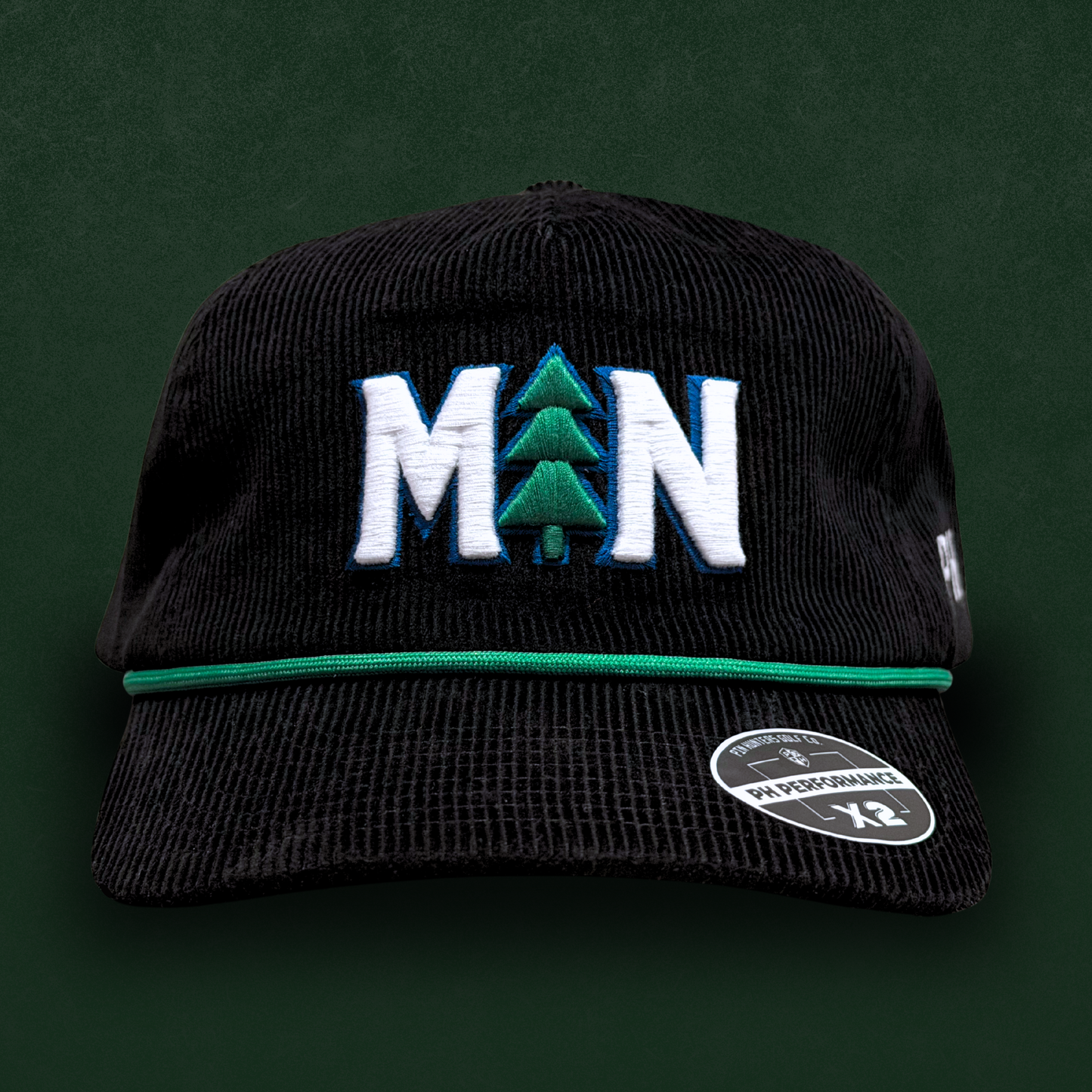 Black MN pine tree Timberwolves corduroy performance hat with white and green embroidery, green rope, flat brim, and PH Performance X3 sticker.