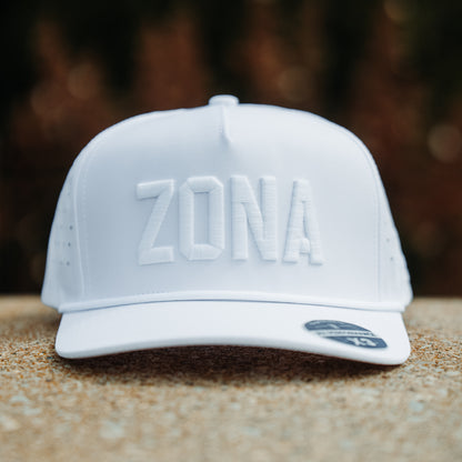 Arizona Cardinals inspired white Zona tonal performance hat with white raised embroidery, matching rope detail, and outdoor stone display.