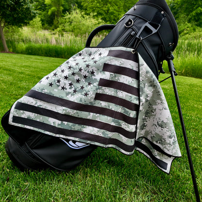 Military digital camo American flag golf towel hanging on a black golf bag with black stars, black stripes, camo print, and patriotic golf towel design.
