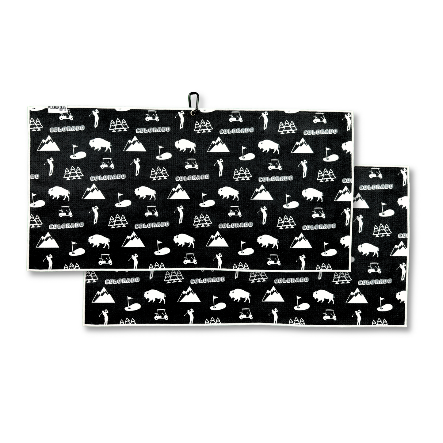 Black Colorado golf towel product image showing a front and back pattern with white Colorado text, mountains, bison, pine trees, golfers, carts, and golf flags.