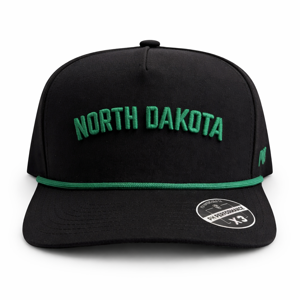 Front view of the black North Dakota Performance Hat by Pin Hunters Golf Co. with green NORTH DAKOTA embroidery and matching green rope detail.