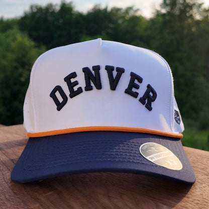 Front view of the Denver performance golf hat with black raised Denver embroidery, white crown, orange rope, navy brim, and PH Performance sticker.