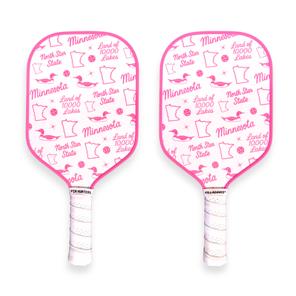 Minnesota pickleball paddles with pink trim, white face, and repeating pink loon, state outline, pickleball, and Land of 10,000 Lakes icons.