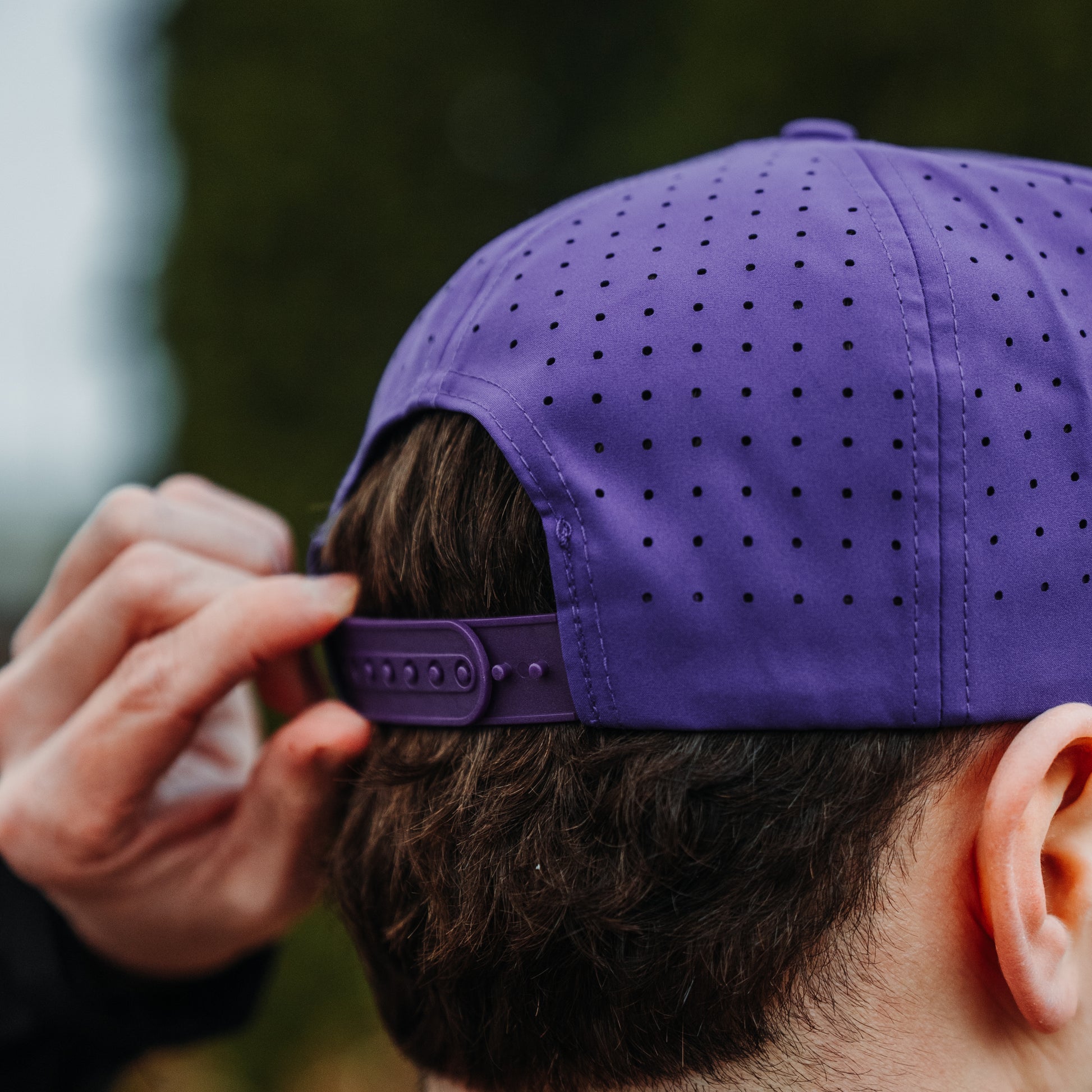 Minnesota Vikings purple performance hat back view with perforated panels, adjustable snapback closure, and purple crown.