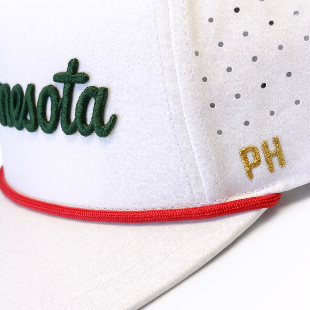 Minnesota Wild inspired white performance hat close-up with green script embroidery, red rope detail, gold PH side embroidery, and perforated side panels.
