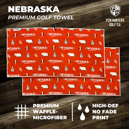 Nebraska Cornhuskers premium golf towel layout with red waffle microfiber, state outlines, foam fingers, golfer icons, and front/back views.