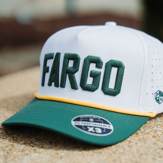 North Dakota State Bison Fargo performance hat front angle with green FARGO embroidery, white crown, green brim, yellow rope, and PH Performance X3 sticker.