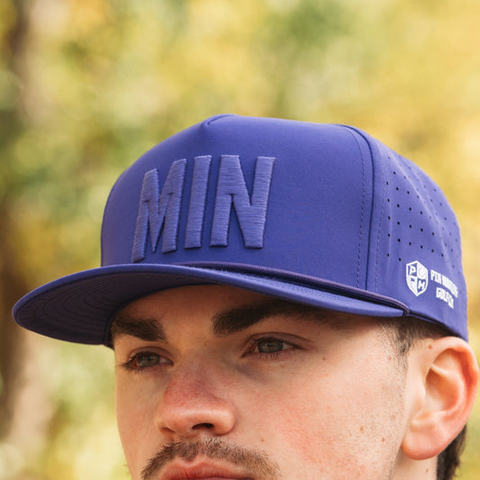 Purple MIN Performance Hat front view by Pin Hunters Golf Co. with tonal raised MIN embroidery and matching rope detail.