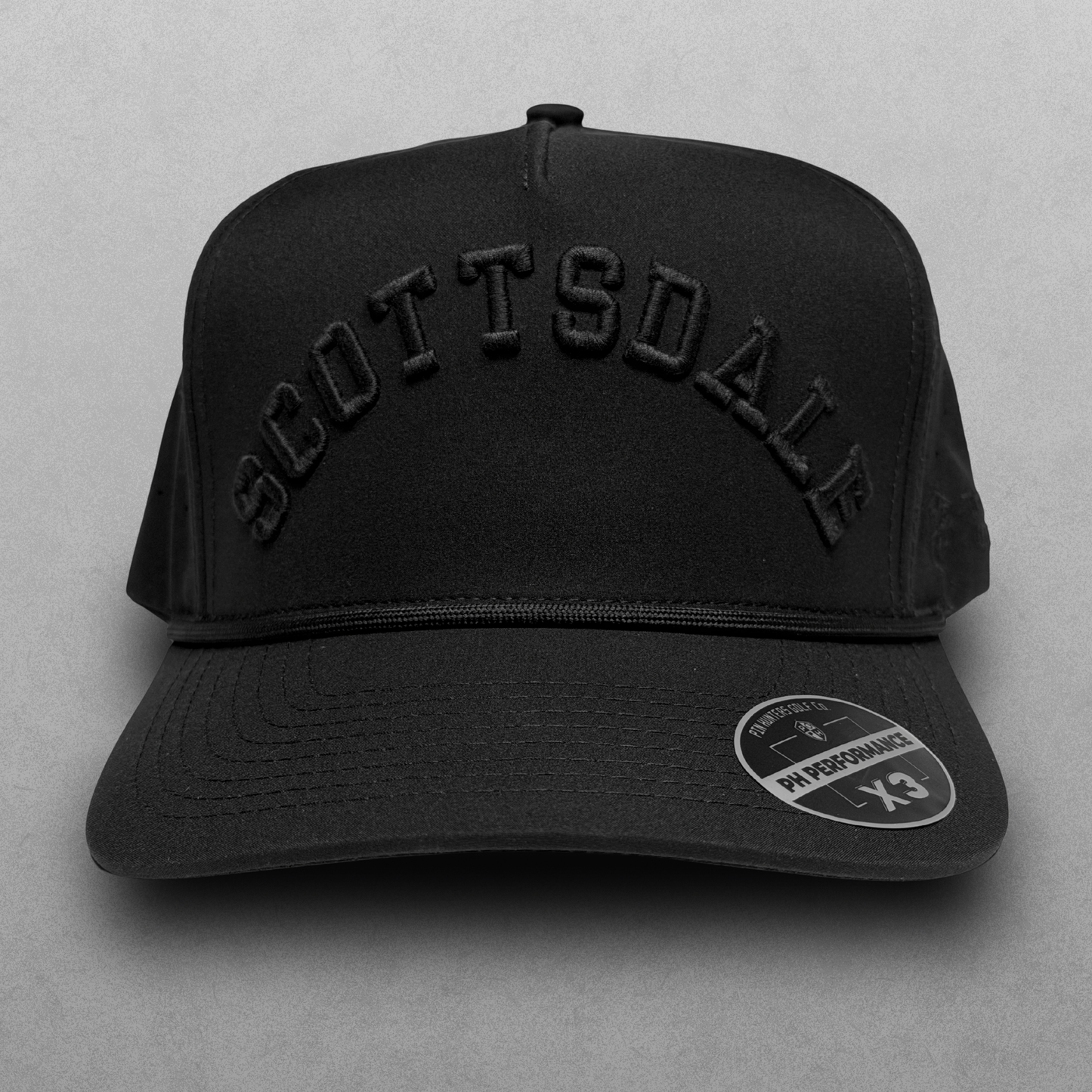 Black Scottsdale performance hat with tonal black raised embroidery, black rope detail, and PH Performance X3 sticker.