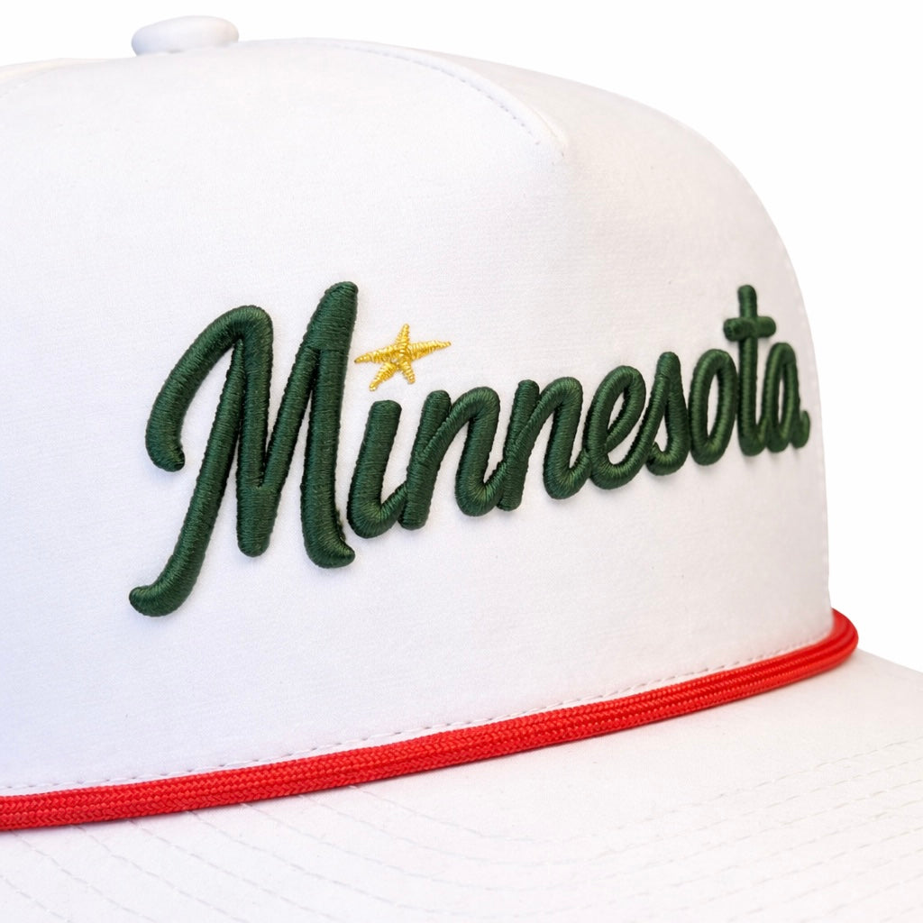 White Minnesota wild script performance golf hat with green embroidered script, yellow star accent, and red rope detail.