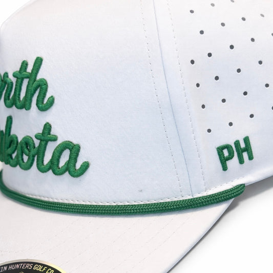 Close-up side detail of the white North Dakota Performance Hat showing green PH embroidery, perforated side panels, and green rope accent.
