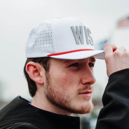 White WIS performance golf hat on model with gray raised embroidery, red rope detail, and perforated side panels.