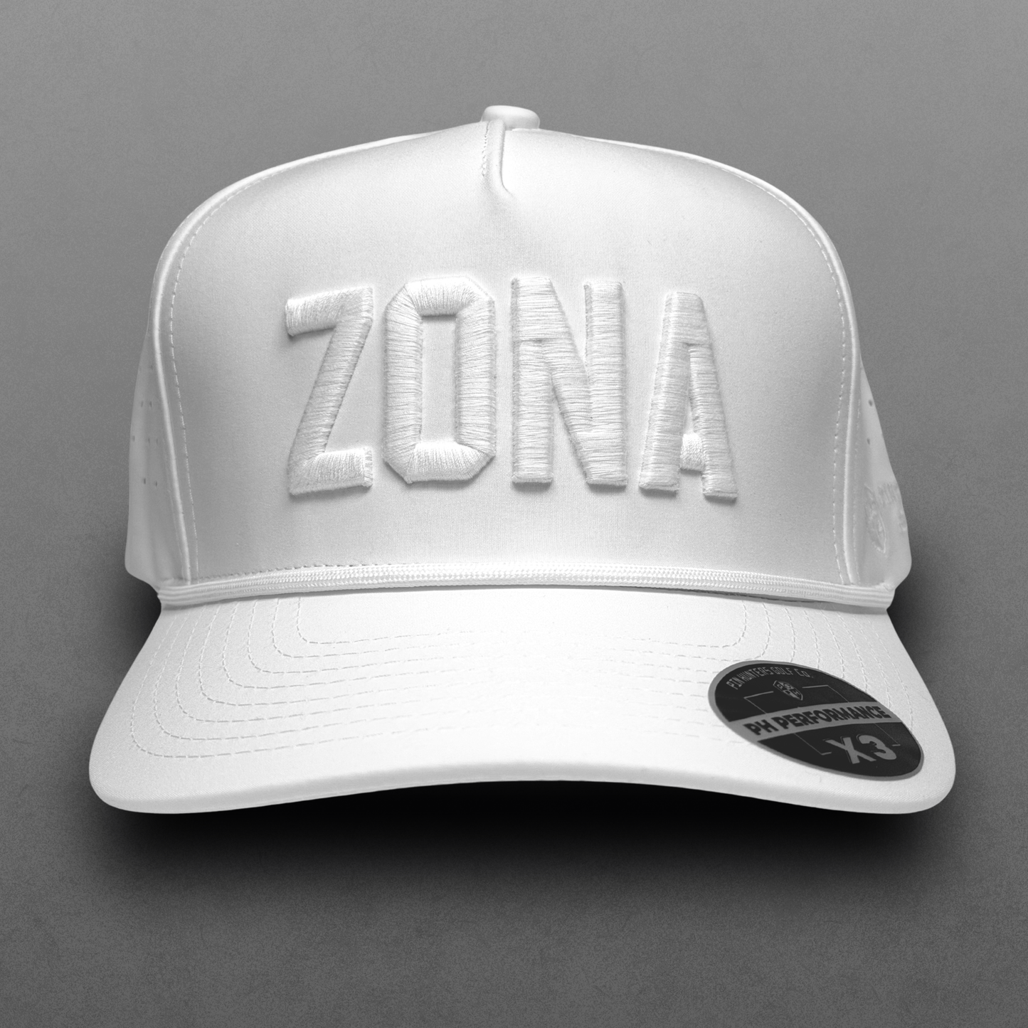 White ZONA performance hat with tonal white raised embroidery, white rope detail, perforated side panels, and PH Performance X3 sticker.