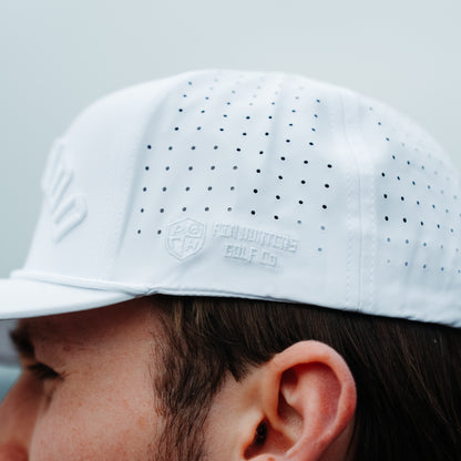 Whiteout Zona performance hat side close-up with tonal white PH logo embroidery, perforated side panels, and white performance fabric.